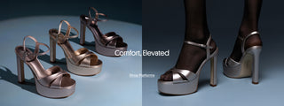 Product image showing metallic platform high-heel sandals with ankle straps in silver and champagne tones, displayed on a blue surface. On the right, a model wearing black tights stands in silver platform heels. White overlay text reads “Comfort, Elevated” with a link-style caption “Shop Platforms".