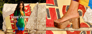 Model wearing a colorful dress standing beside a wooden platform sandal with clear straps against a painted wall.