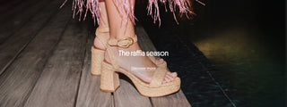 Person wearing beige raffia platform sandals with block heels standing on a wooden deck beside a pool. The banner features the text “The raffia season” and a “Discover more” call-to-action.