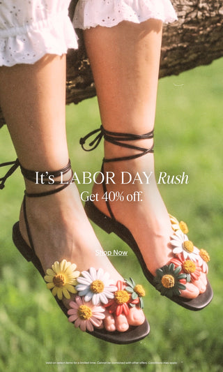 Labor Day sale banner featuring a model wearing black lace-up sandals adorned with colorful floral details, with text promoting 40% off select items.
