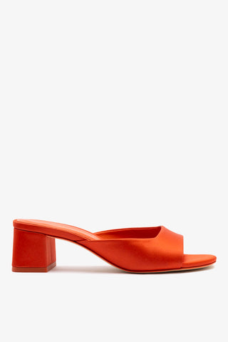 Chloe Gosselin by Larroudé Anah Mule In Orange Sunrise Satin