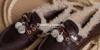 Brown leather Larroudé shearling-lined loafers with decorative laces and textured details.