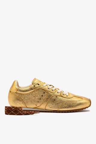 Stella Sneaker In Gold Metallic Leather