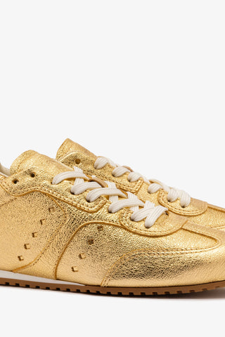 Stella Sneaker In Gold Metallic Leather